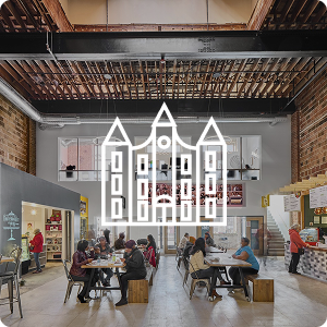 Interior of a nonprofit in Milwaukee with a building icon overlaying image.