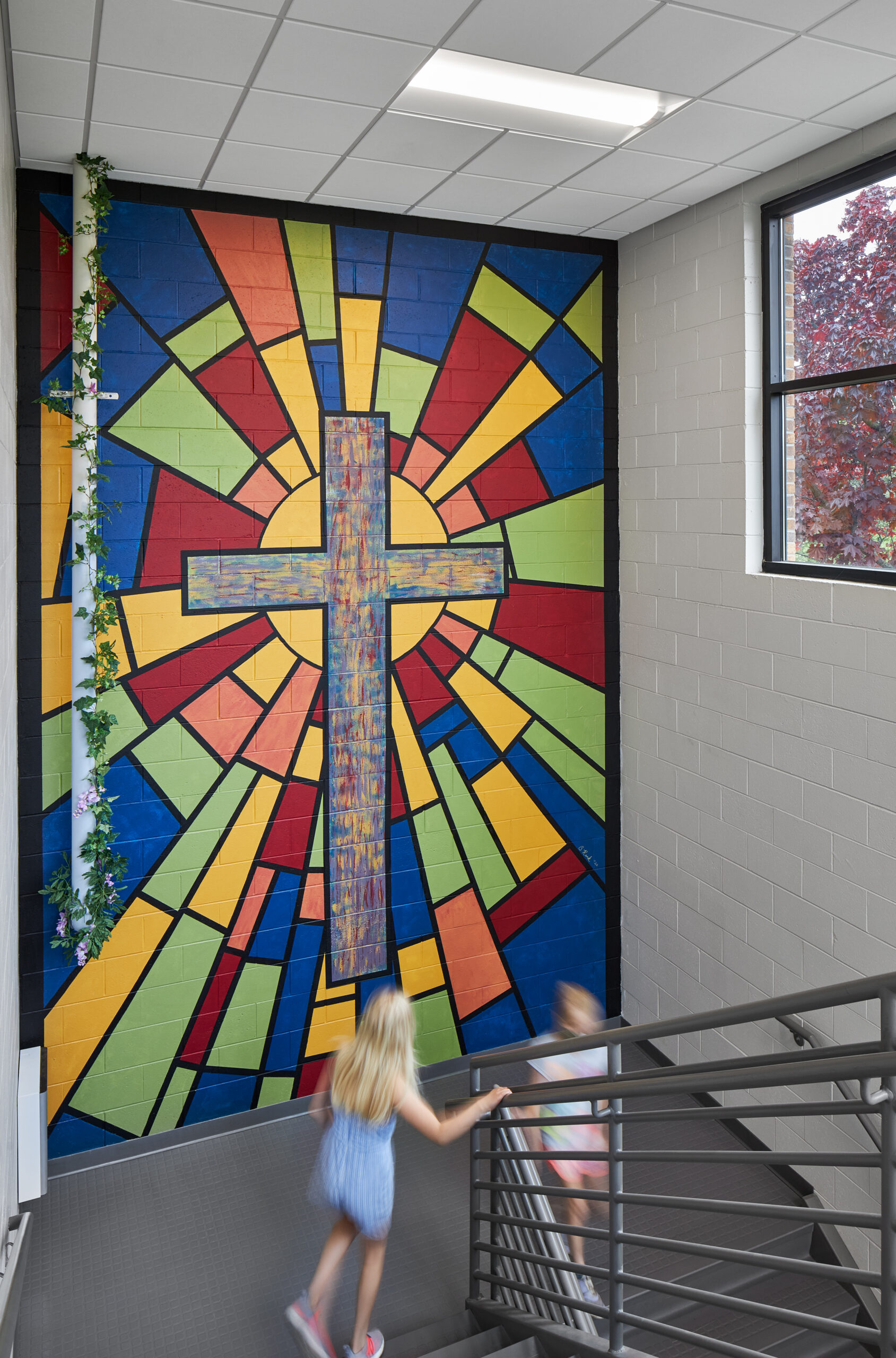 First Immanuel Lutheran stairwell with a large cross.