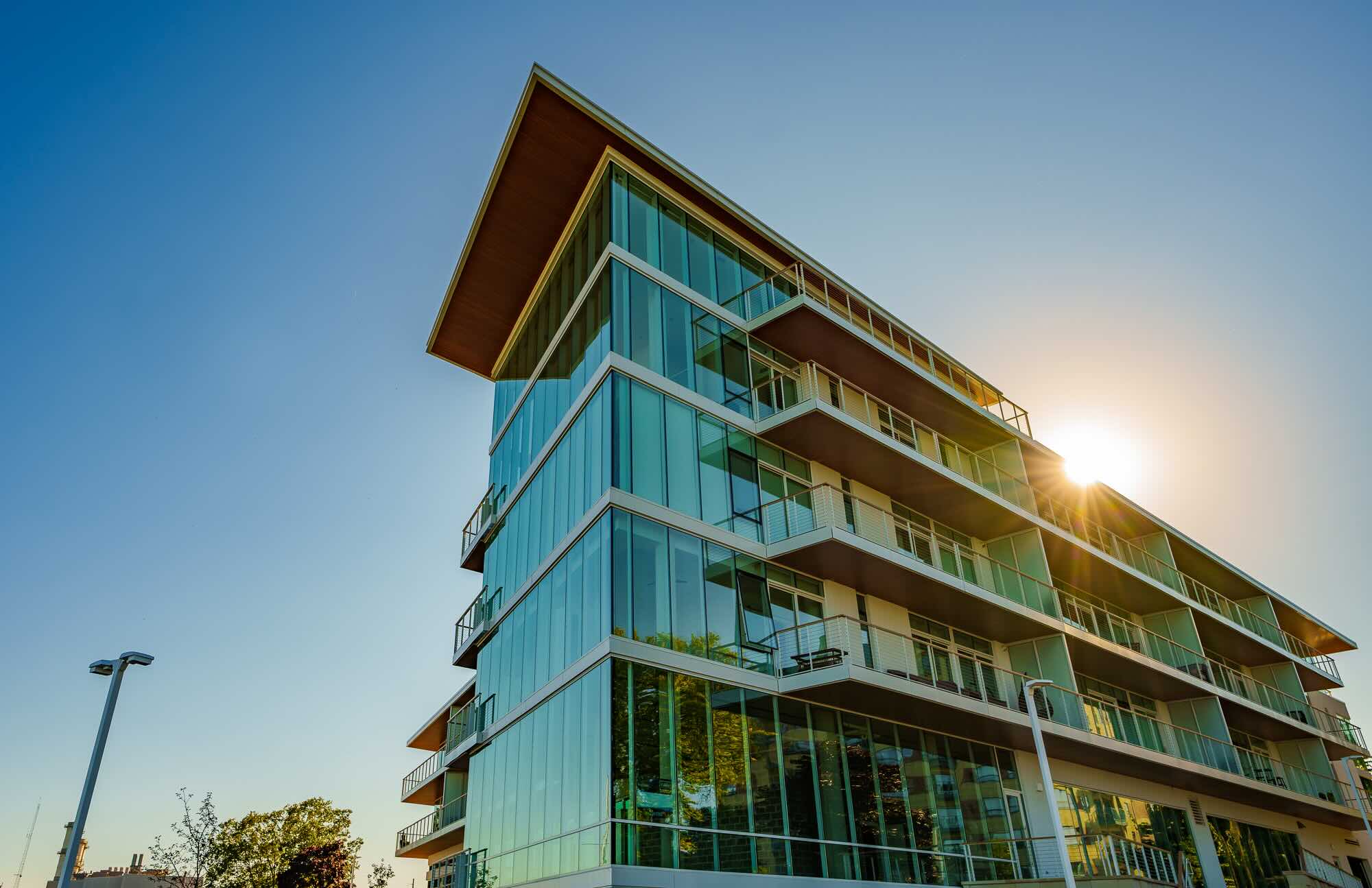 Newport Shores showing a 4-5 storied glass building.