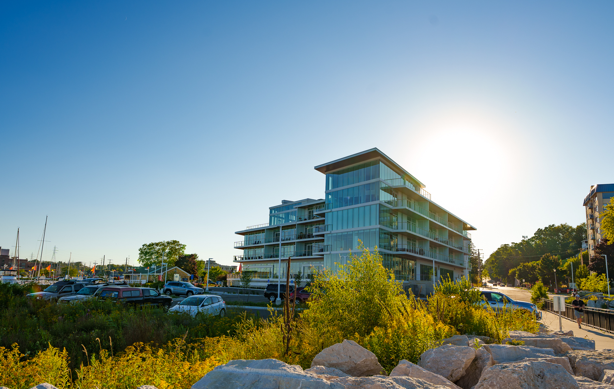 Newport Shores showing a 4-5 storied glass building.