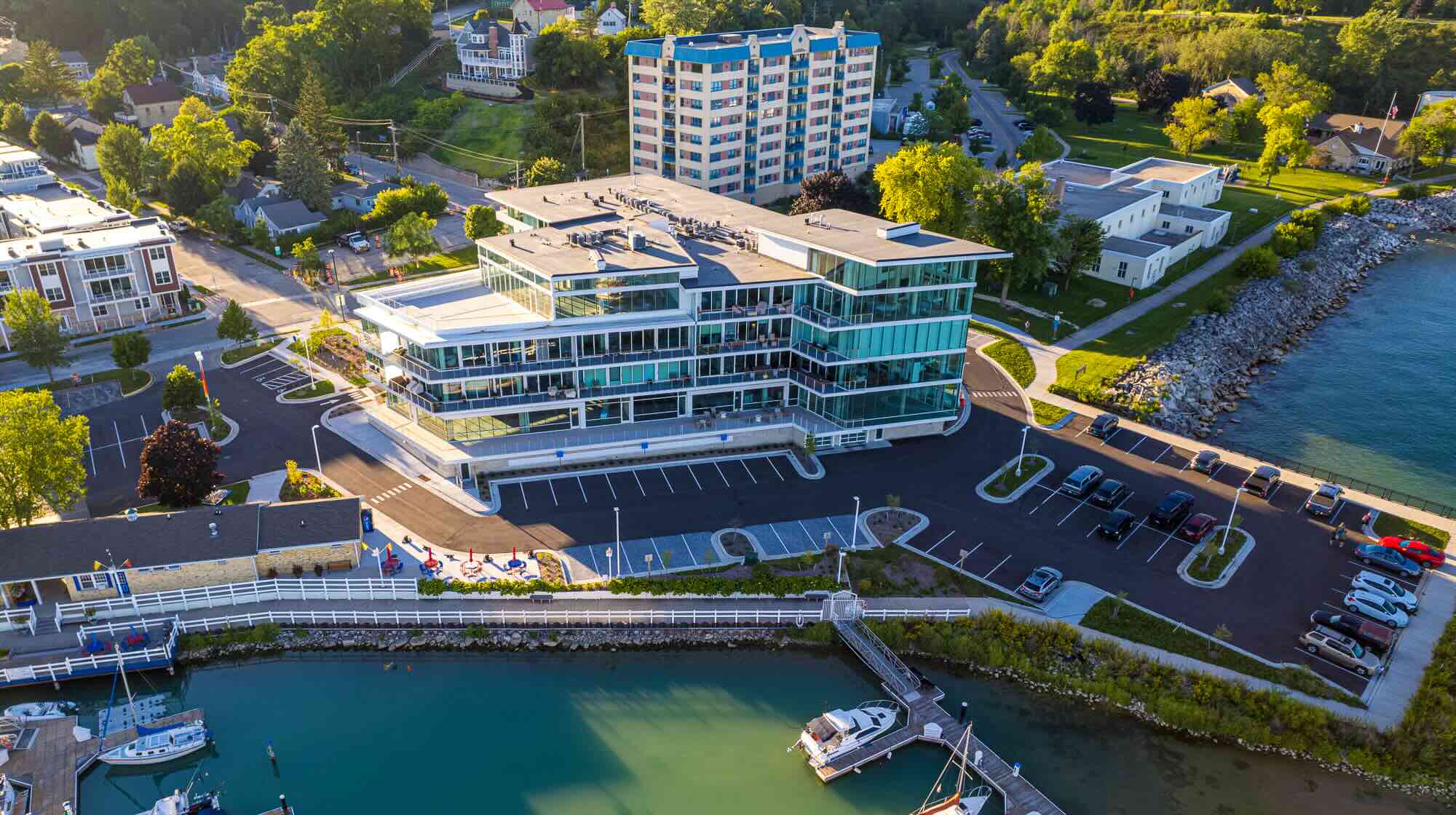 Newport is seated a few steps from a dock where boats can be seen.