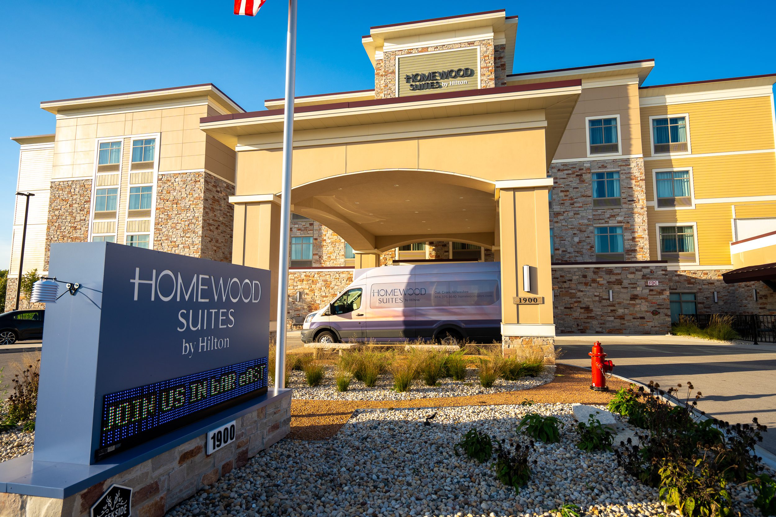 Van pulled up to the front of the hotel.