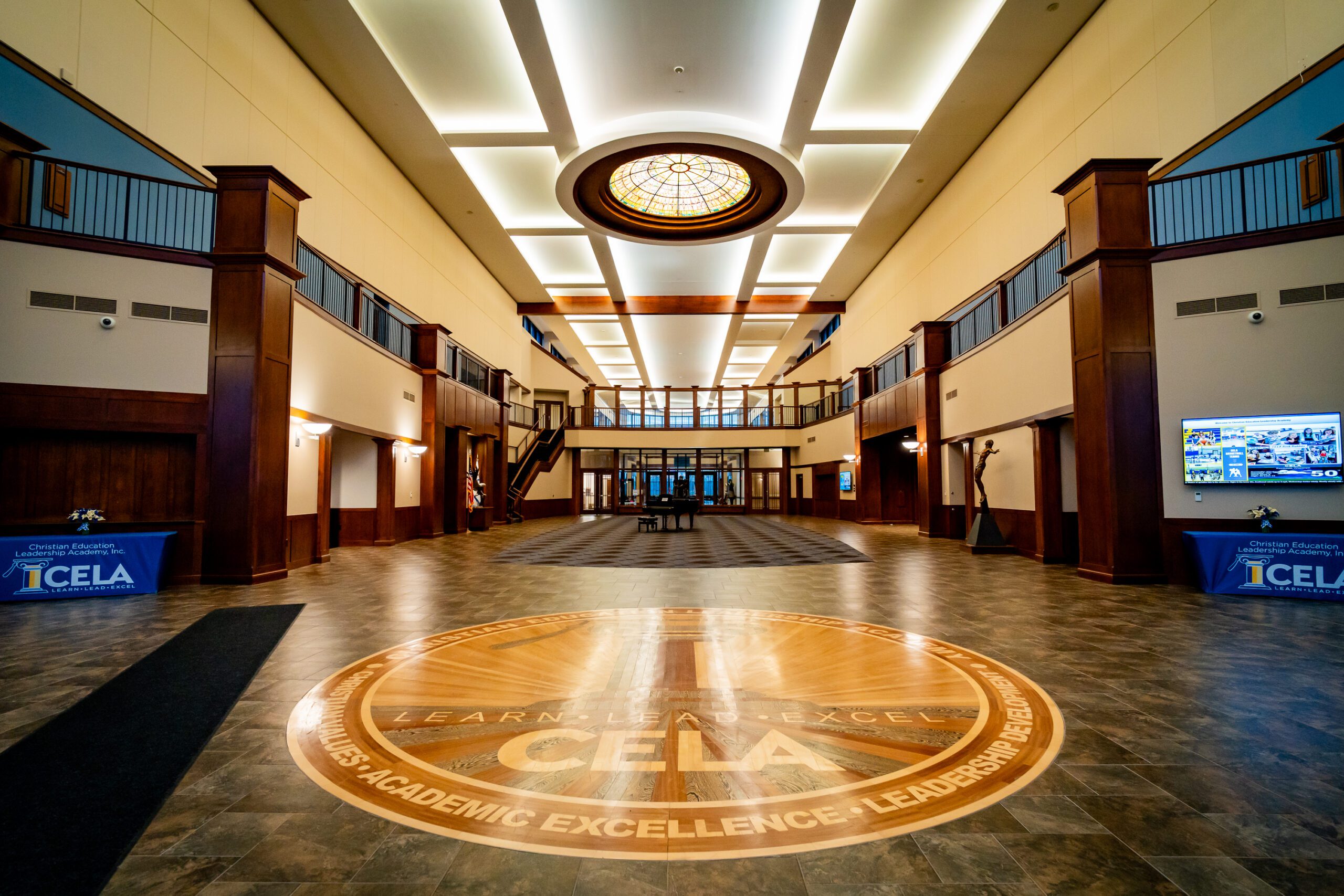 Large CELA emblem on the floor.